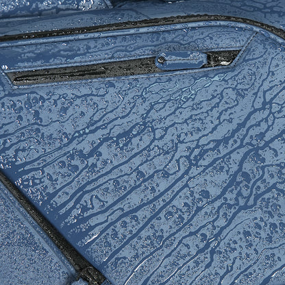 Close-up of a textured blue surface with water droplets.
